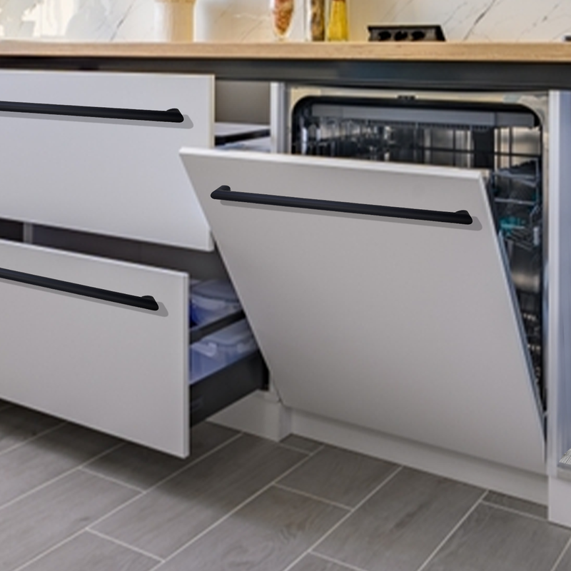 A modern kitchen with partially opened white drawers and a built-in dishwasher with its door open, showing clean dishes inside. The floor has gray tiles, and the counter is light wood.