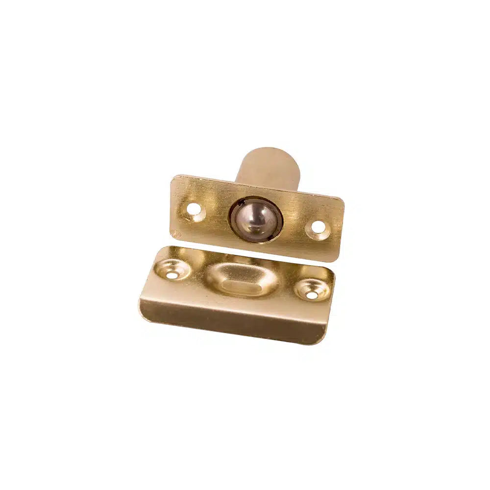 The Taymor Industries brass door ball catch features a zinc die-cast body, rectangular faceplate, mounting screws, and an adjustable latch for a secure fit—ideal for closet or cabinet doors.