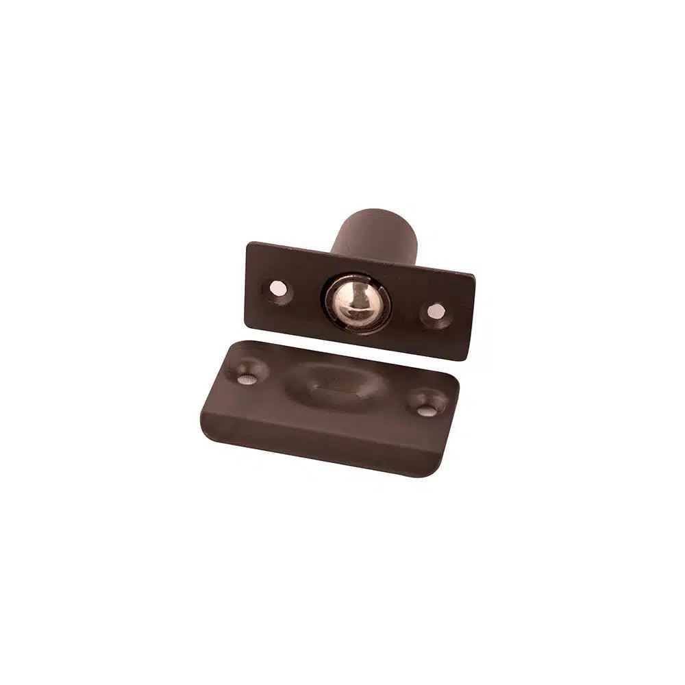 A Taymor Industries brown ball catch latch with zinc die-cast body, rectangular faceplate, adjustable door latch, and matching stamped steel strike plate for cabinet or closet doors, isolated on white background.