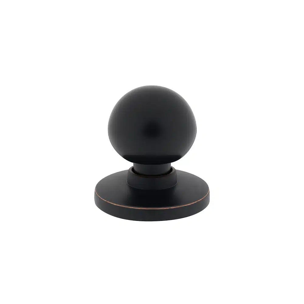 A matte black round door knob from Taymor Industries featuring a spherical handle on a zinc diecast circular back plate, displayed against a plain white background.