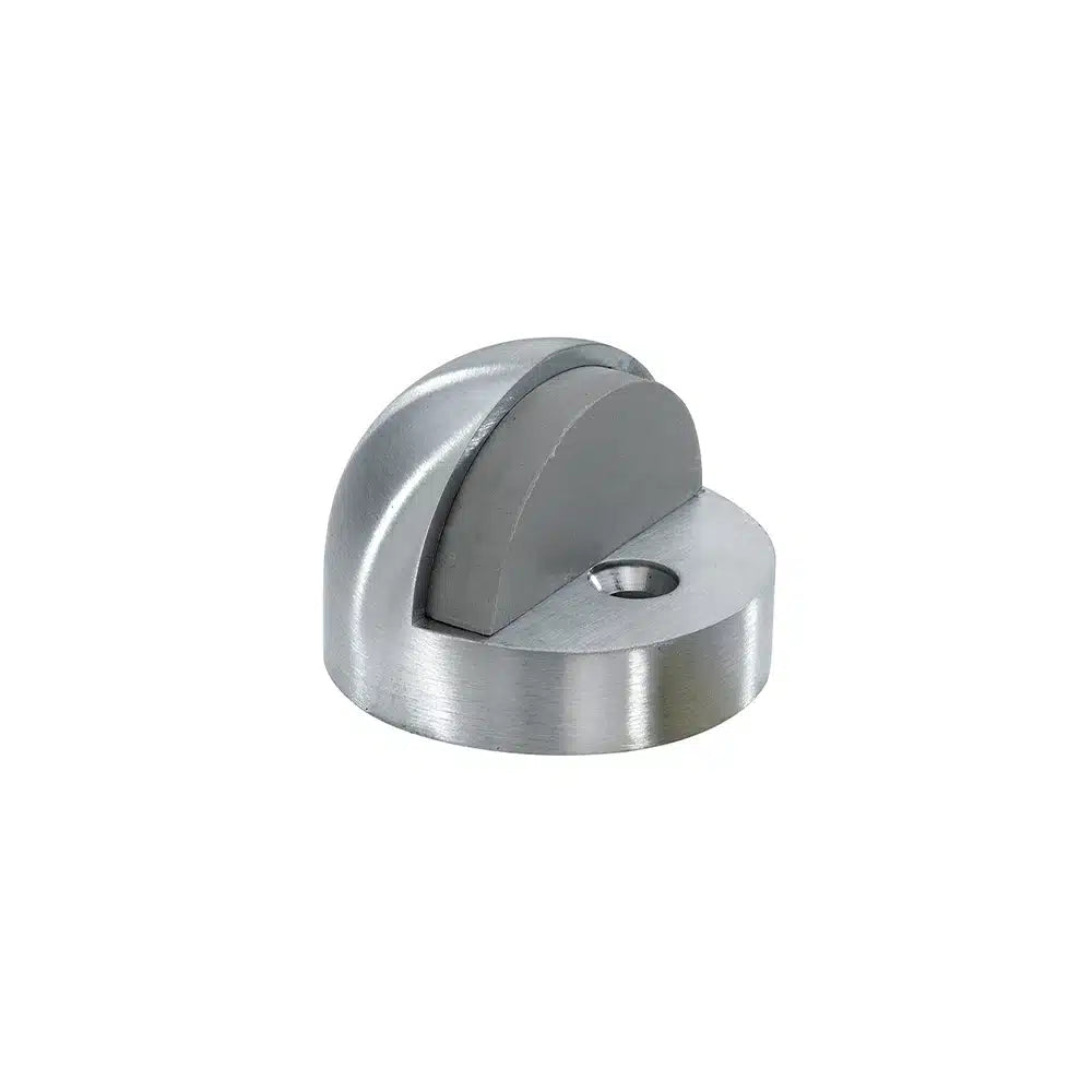 The Taymor Industries silver zinc die-cast door stopper features a curved, dome-shaped design with a rubber insert and a screw hole at the base for secure floor mounting with an included screw and expansion shield.