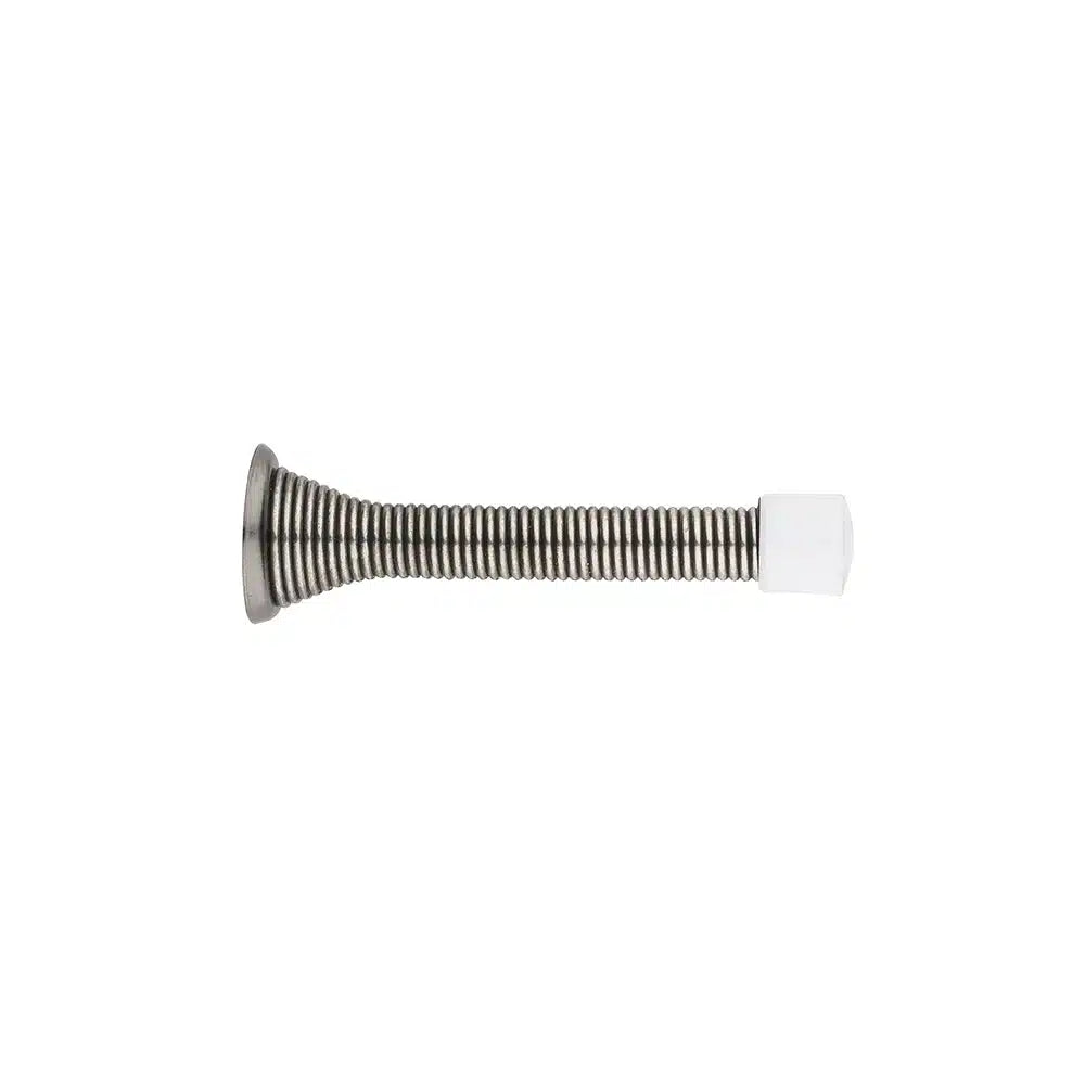 A Taymor Industries metal door stopper features a coiled steel spring body, a sturdy metal base for mounting, and a white rubber tip on the end, shown against a plain white background.
