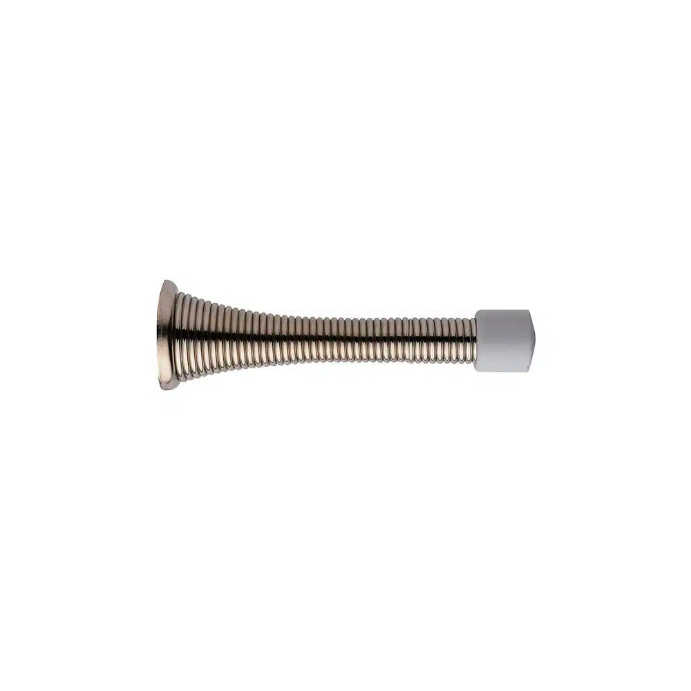 A Taymor Industries metal spring door stopper with steel wire, a wide metal base, and a white rubber tip is shown against a plain white background.