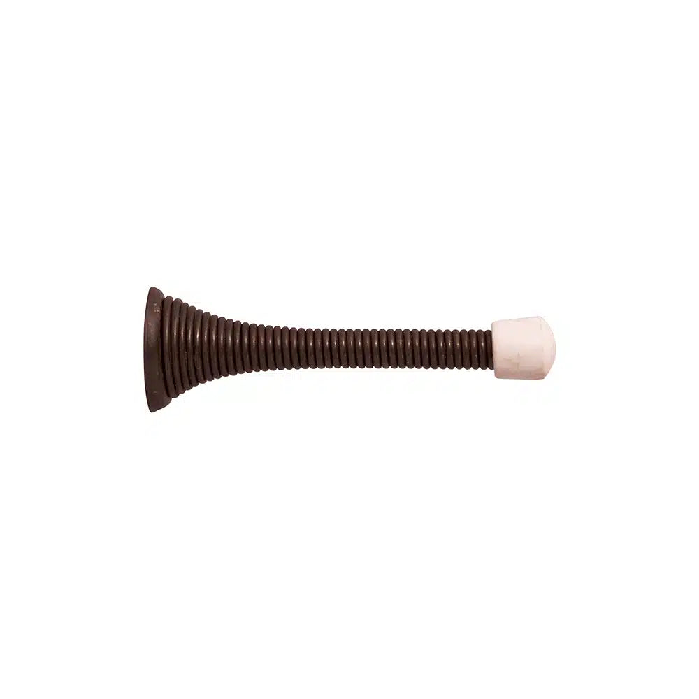 A Taymor Industries coiled steel spring wire door stopper features a sturdy metal base on one end and a white rubber tip on the other, shown isolated against a white background.
