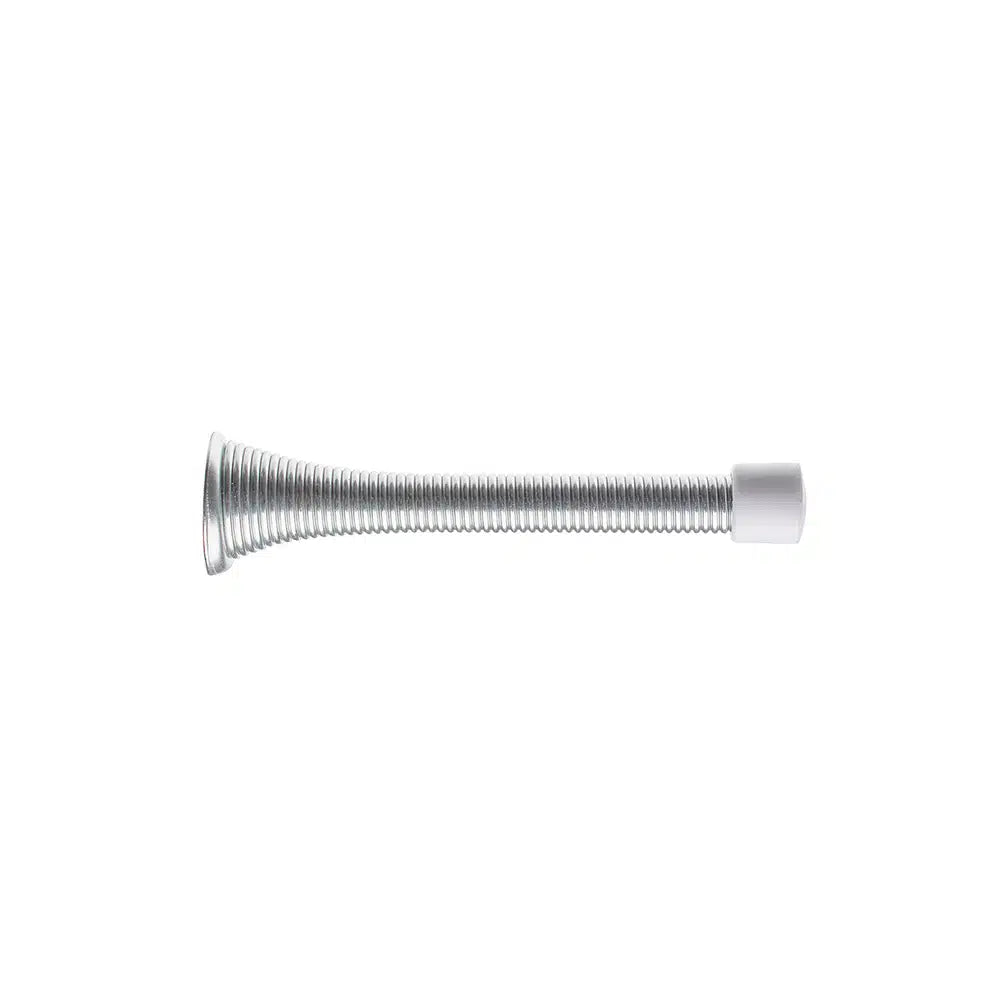 The Taymor Industries doorstop has a flexible coiled steel spring body with a white rubber tip at one end and a sturdy 15/16-inch diameter base, shown isolated on a white background.