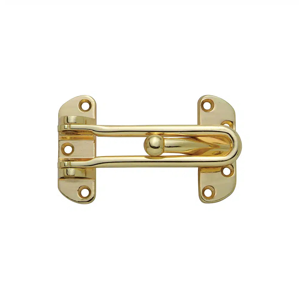 A shiny brass Taymor Industries door security latch made of solid metal, featuring four screw holes per side. Mounted on a white background, the pivoting arm secures or releases the door and is easy to install.