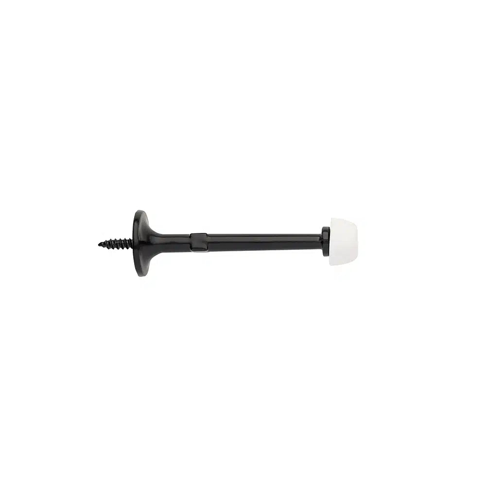 A Taymor Industries black zinc die-cast door stopper with a fixed screw mount and white rubber tip, displayed on a plain white background.