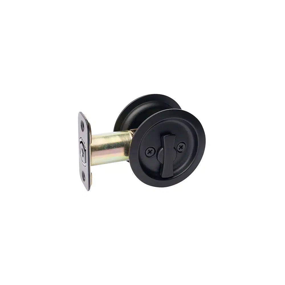 Taymor Industries black round pocket door privacy lock with turn lever, reversible lock, and metal latch face plate featuring a radius corner latch, shown isolated on a white background.