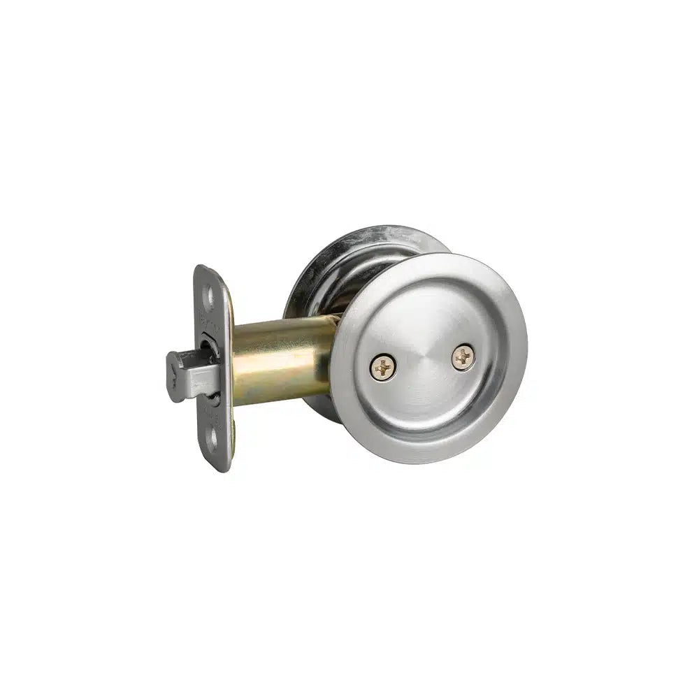 The Taymor Industries round brushed nickel pocket door lock has a recessed pull handle, latch mechanism with reversible lock, and radius corner latch—ideal for sliding doors—shown against a white background.