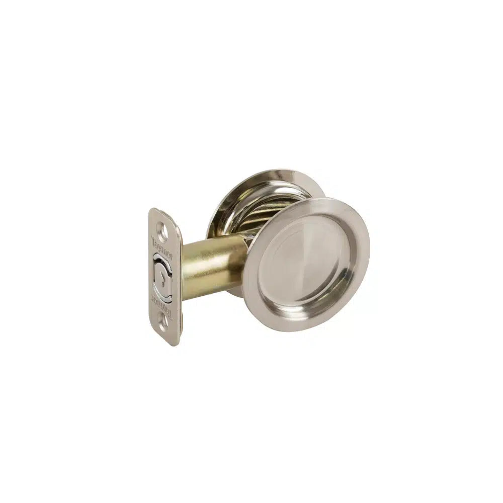 Taymor Industries brushed nickel round pocket door latch features a circular recessed handle and rectangular latch face plate, designed for sliding doors.