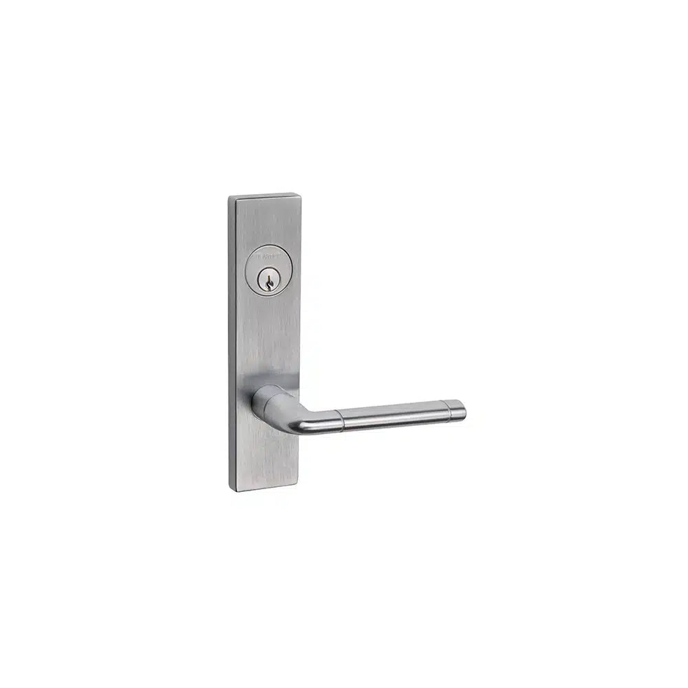 A modern Taymor Industries brushed metal door lever handle with a rectangular backplate and keyhole above the handle features an SC1 6-pin keyway, isolated on a white background.