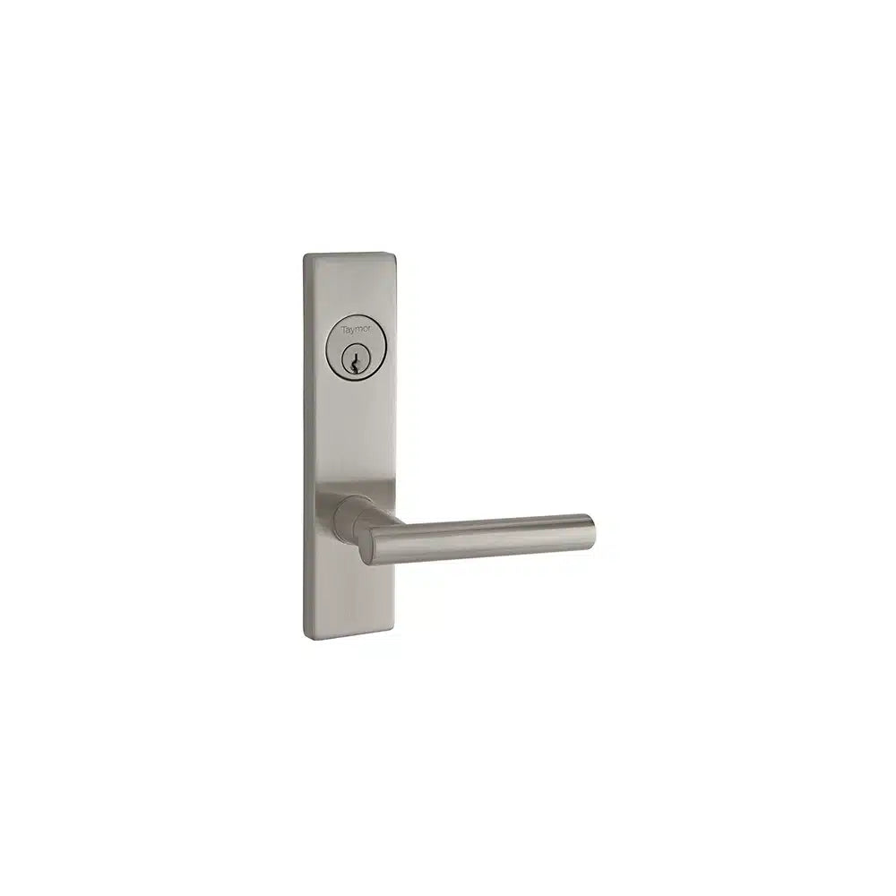 A Taymor Industries modern silver door handle with a rectangular backplate and keyhole above the lever, featuring a 6-pin keyway for added security, is set against a plain white background.