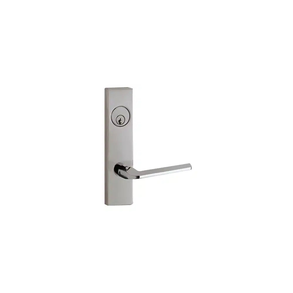 The Taymor Industries door handle features a modern rectangular design with a cylindrical 6-pin keyway above a straight horizontal lever in a silver metallic finish, mounted on a white background.