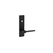 A modern black door handle by Taymor Industries, featuring a rectangular backplate and a 6-pin keyway above the handle, set against a plain white background.