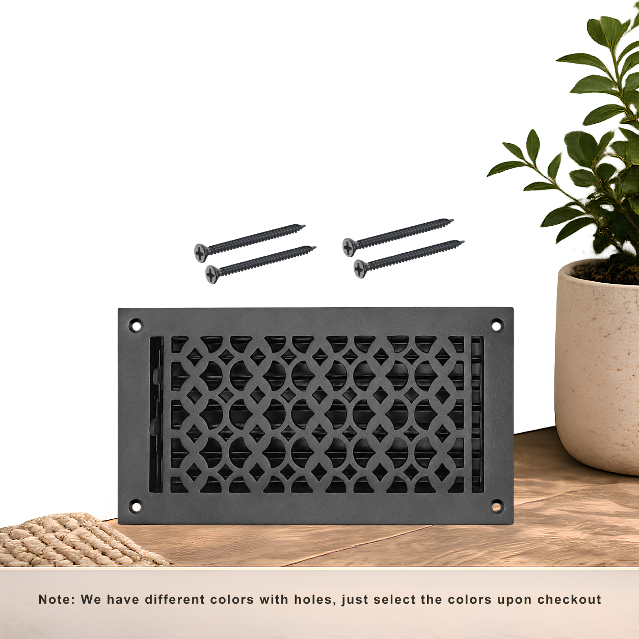Black floor register with holes and screws
