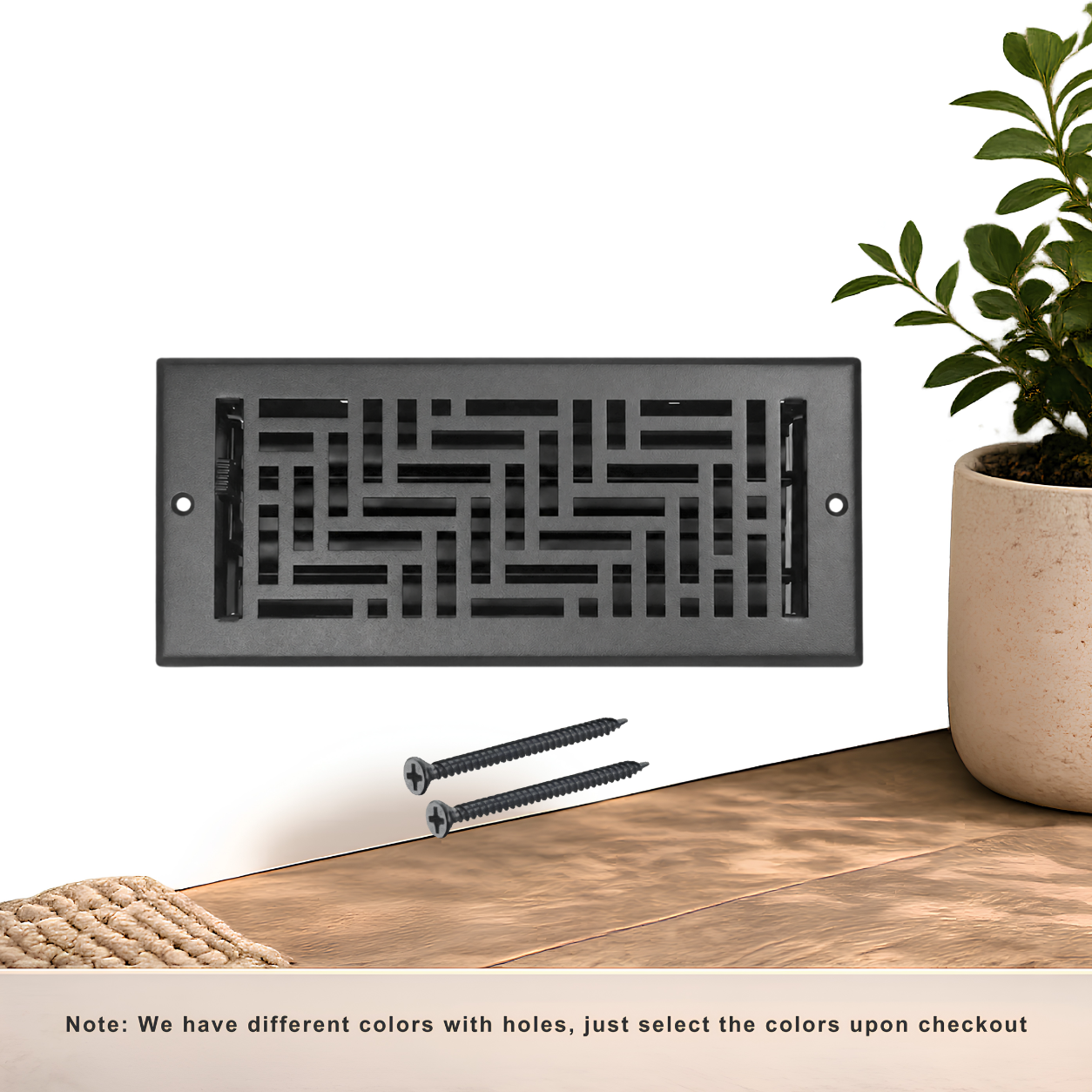 Black floor register with holes and screws
