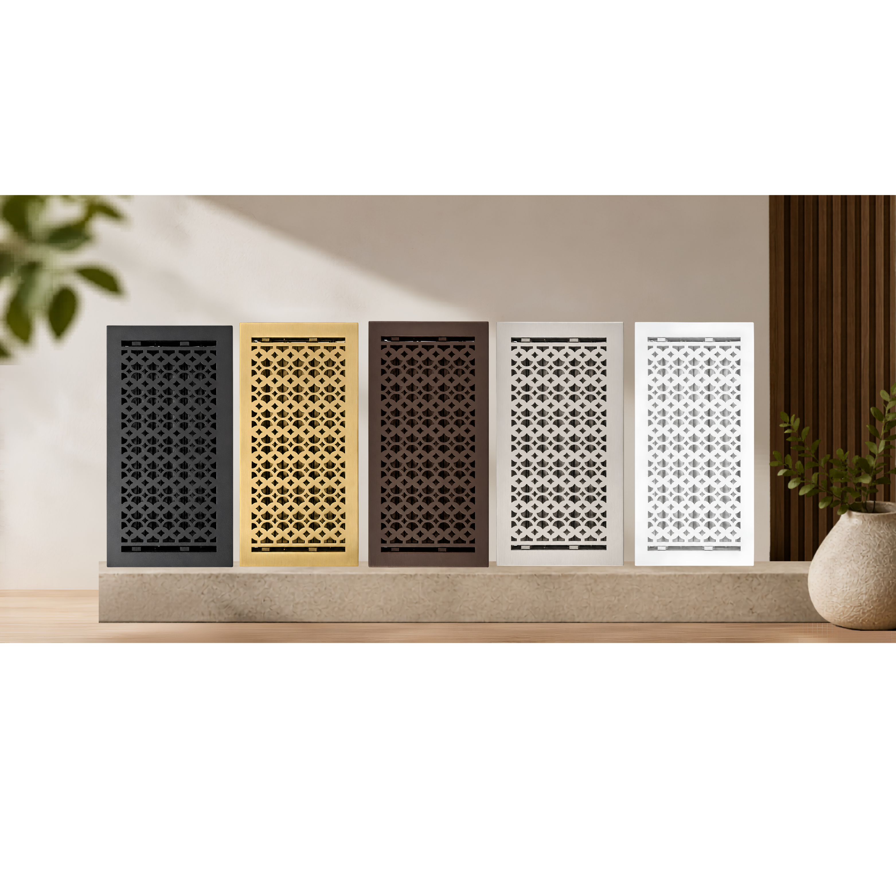 Five decorative air vents in different colors on a wall.