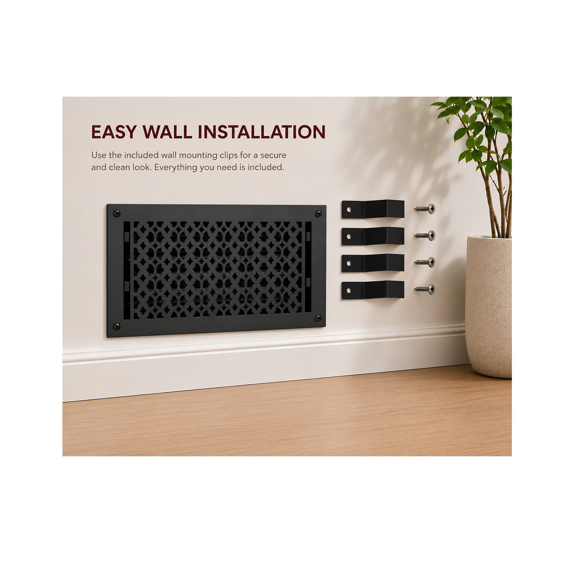 Black decorative wall vent with installation hardware on a white wall.