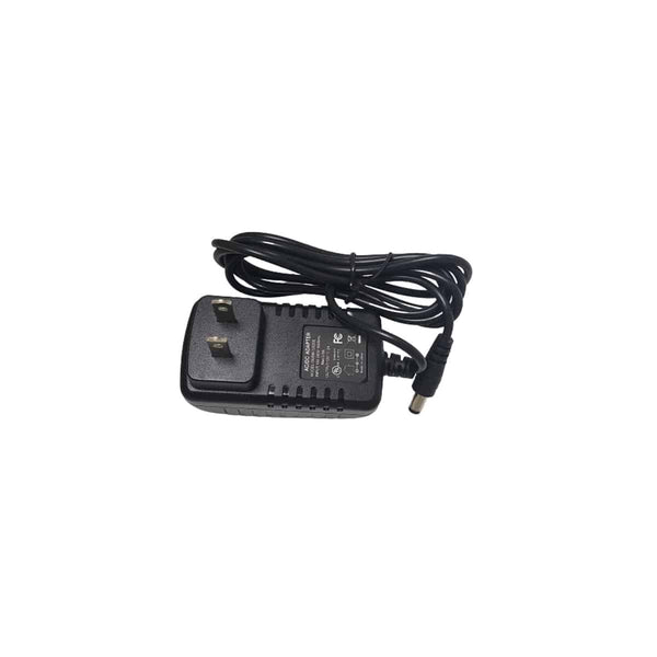 A black AC power adapter with a two-prong plug and an attached cable ending in a cylindrical connector, placed on a white background.