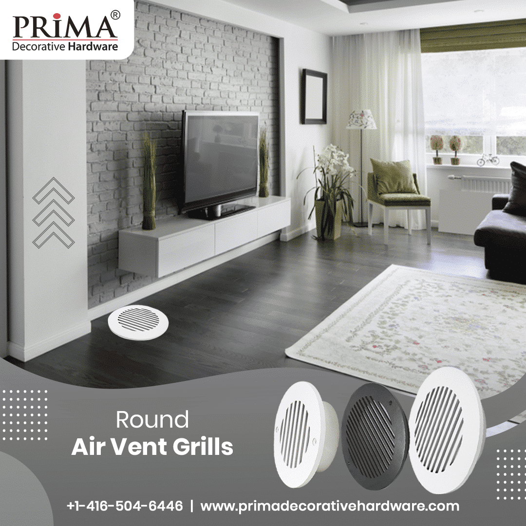 A modern living room features a TV on a gray brick wall, white furniture, and dark wood floors. Three Prima Decorative Hardware round air vent grilles, including a stylish aluminum vent cover, are displayed in the foreground.