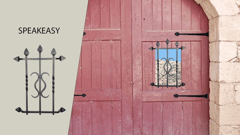Red wooden door with a small iron-barred window and stone frame. To the left, the word SPEAKEASY is above an illustration of decorative black iron bars matching the window design. Blue sky and hills visible through the window.