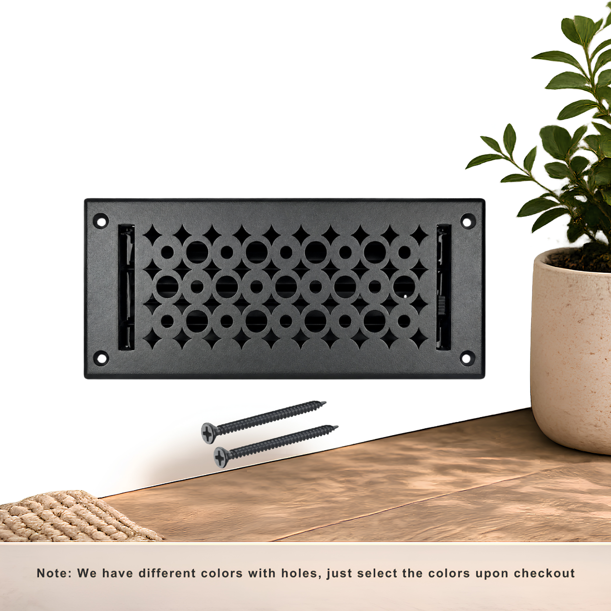 Black floor register with holes and screws
