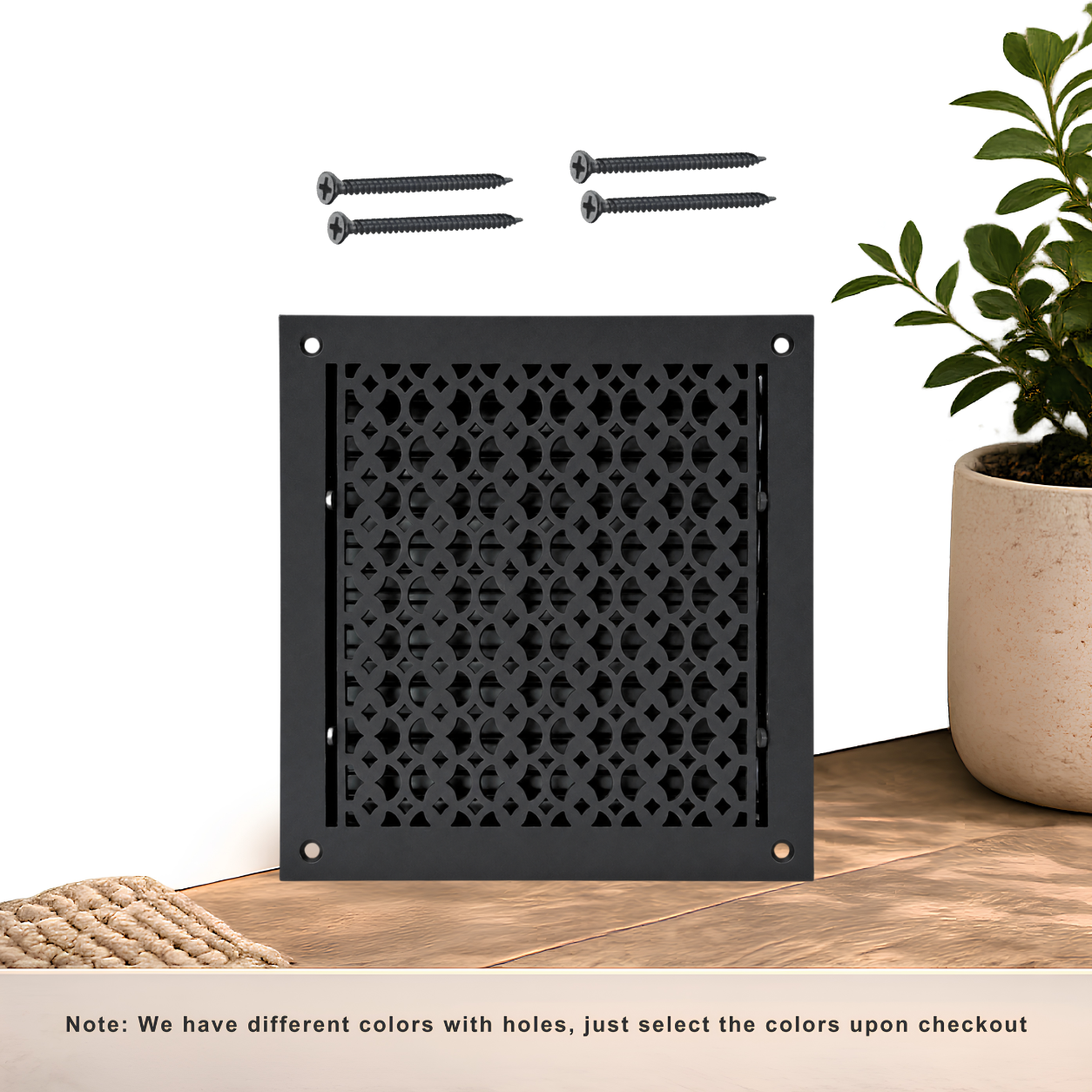 Black floor register with holes and screws
