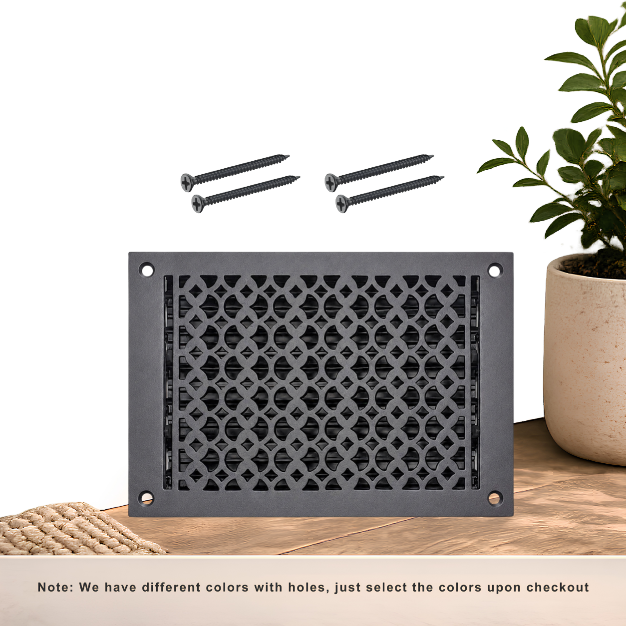 Black floor register with holes and screws
