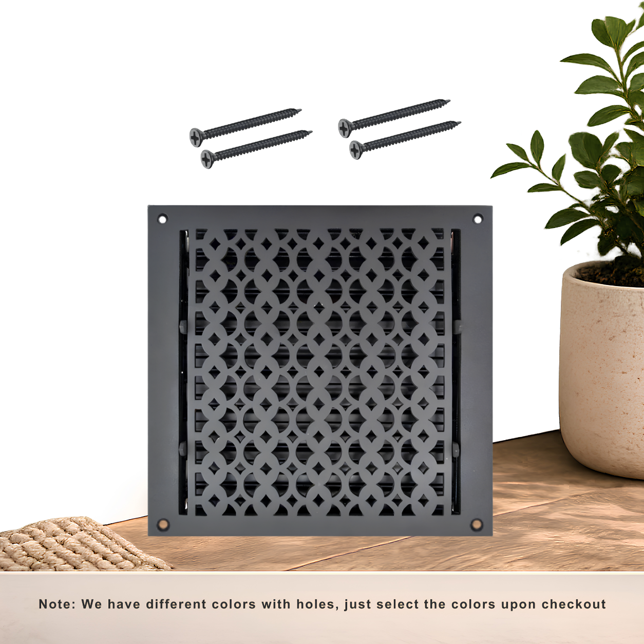 Black floor register with holes and screws

