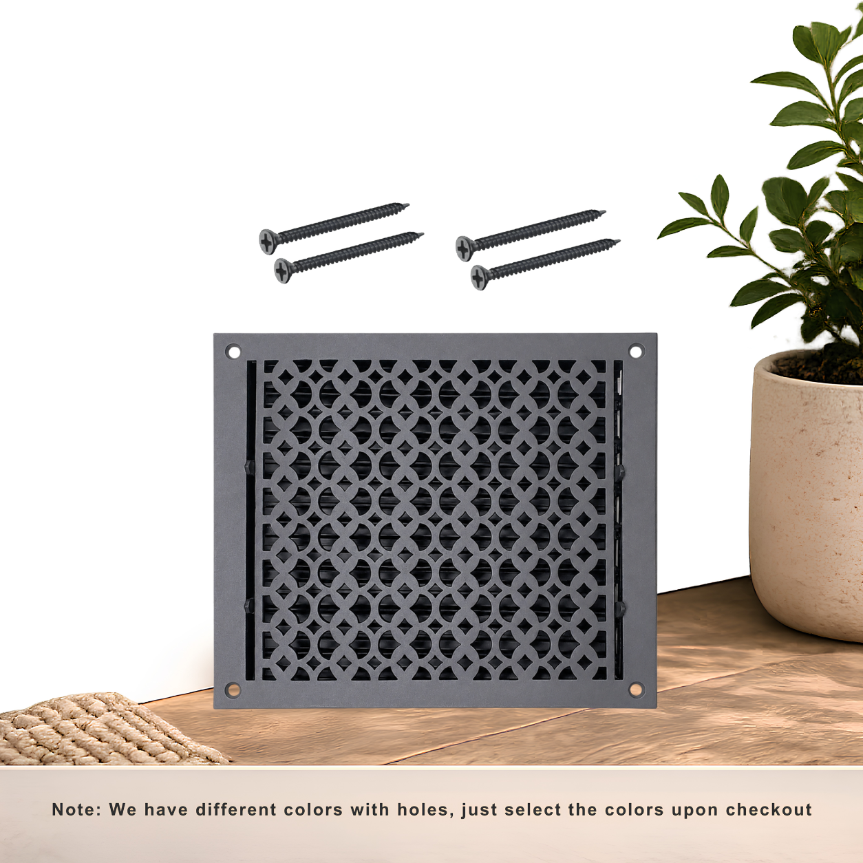 Black floor register with holes and screws
