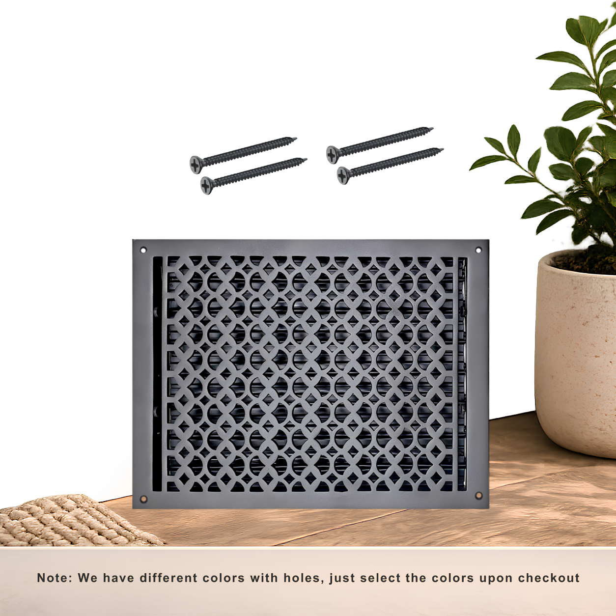 Black floor register with holes and screws
