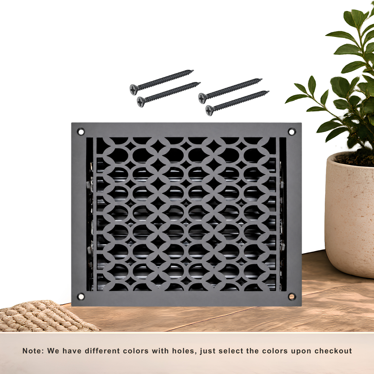 Black floor register with holes and screws
