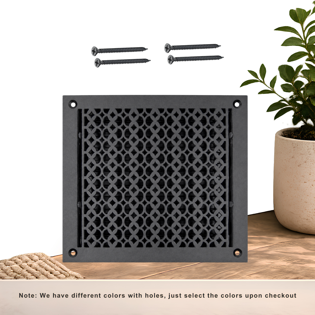 Black floor register with holes and screws
