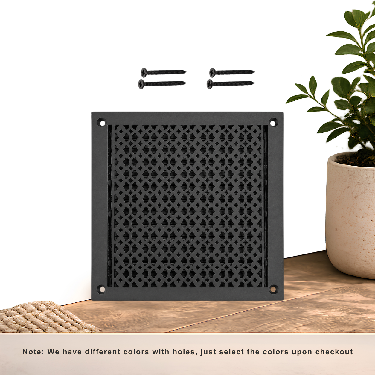 Black floor register with holes and screws
