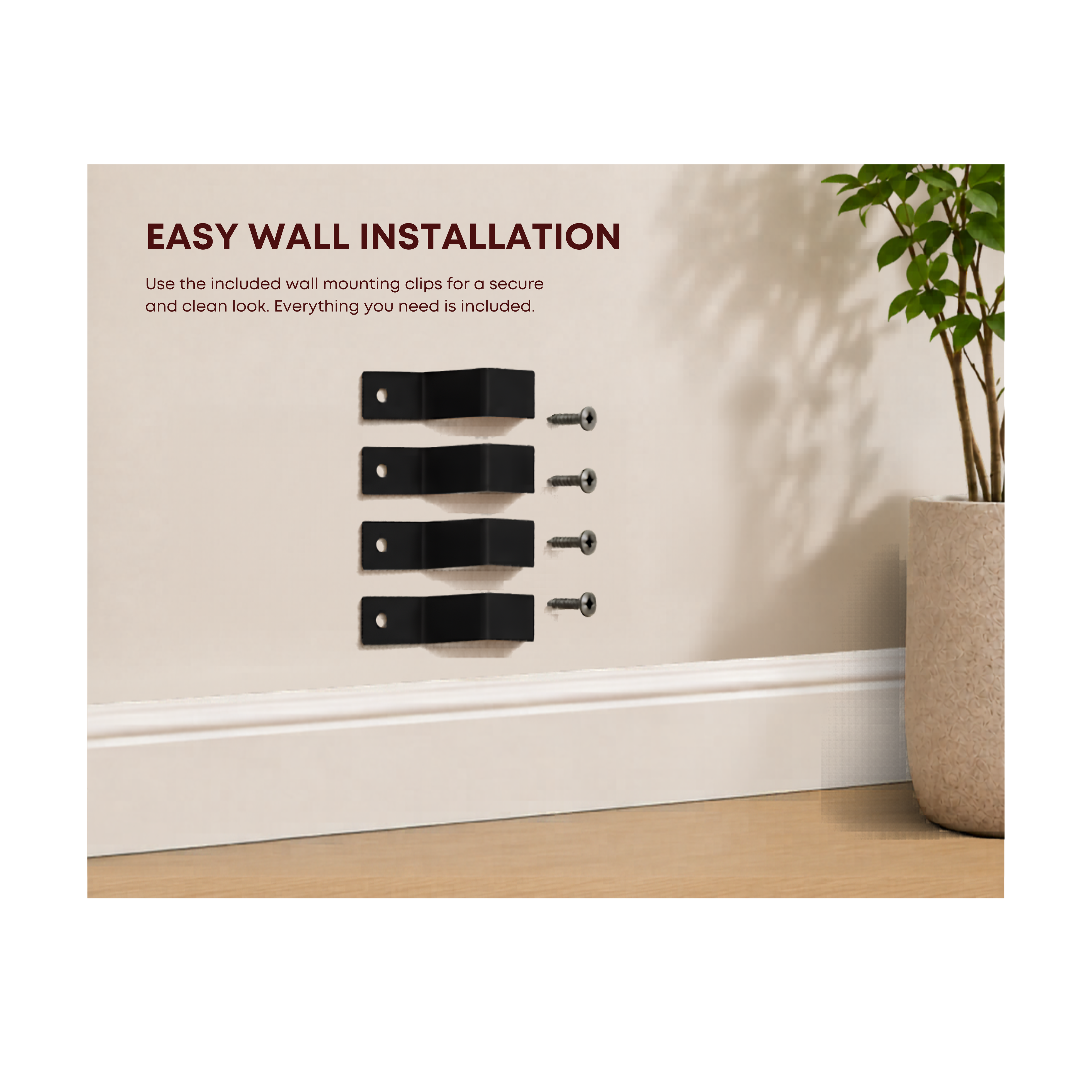 Wall installation clips with text on a wall with a plant in the background
