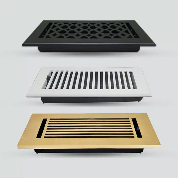 Three rectangular floor vent covers are shown in black with a geometric pattern, white with vertical slats, and gold with horizontal slats, arranged vertically on a light gray background.