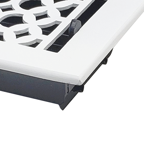 Close-up of a white Prima Decorative Hardware vent cover with a Tudor Mushroom design, circular pattern, and black adjustable lever, partially visible against a white background.