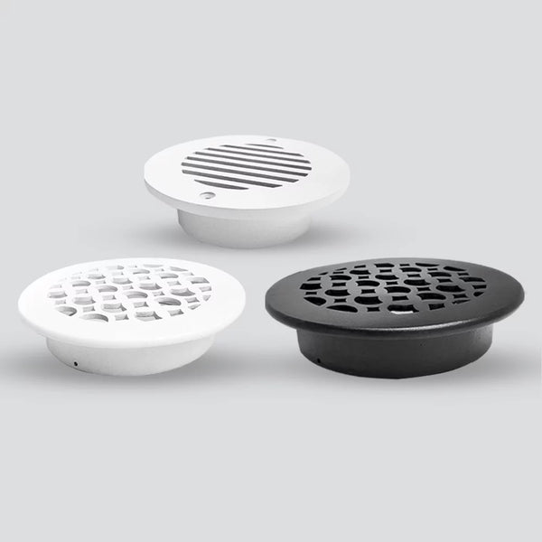 Three round air vent covers in different styles and colors—two white with different grille patterns, and one black with a honeycomb pattern—are displayed on a gray background.