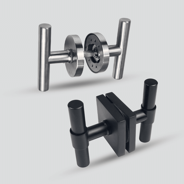 Two metal tools with T-shaped handles are displayed on a light gray background; one is silver with round components, and the other is black with rectangular and cylindrical parts.